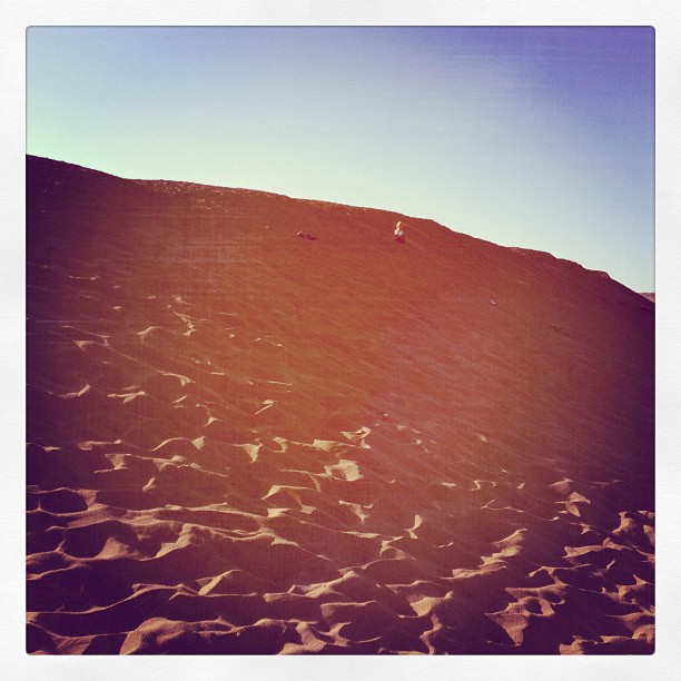 Rush scaling a massive dune...